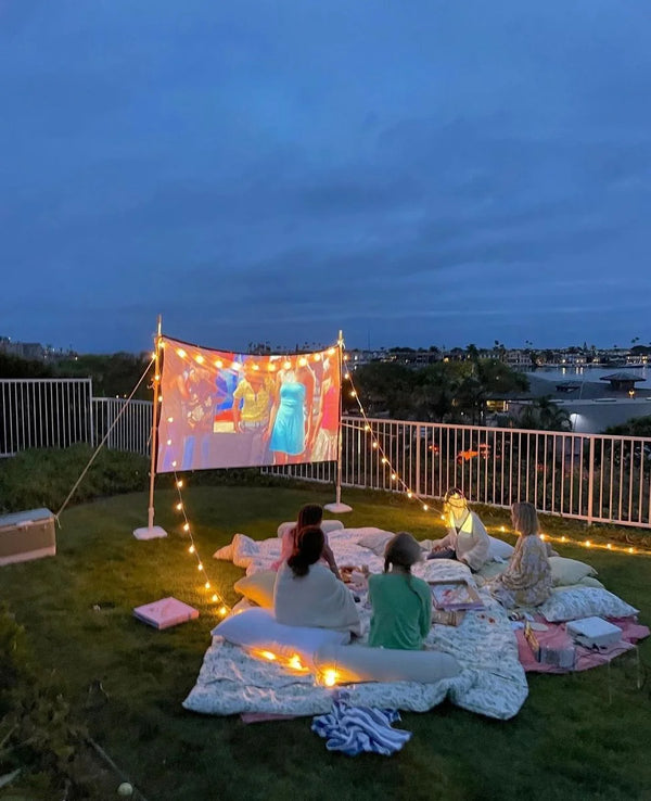 Backyard movie night with the 100 inch screen